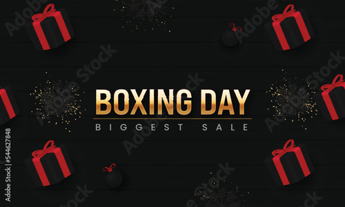 Biggest Boxing Day Sale Banner Design With Realistic Gift Boxes, Snowflakes, Baubles And Glitter Effect On Black Background.