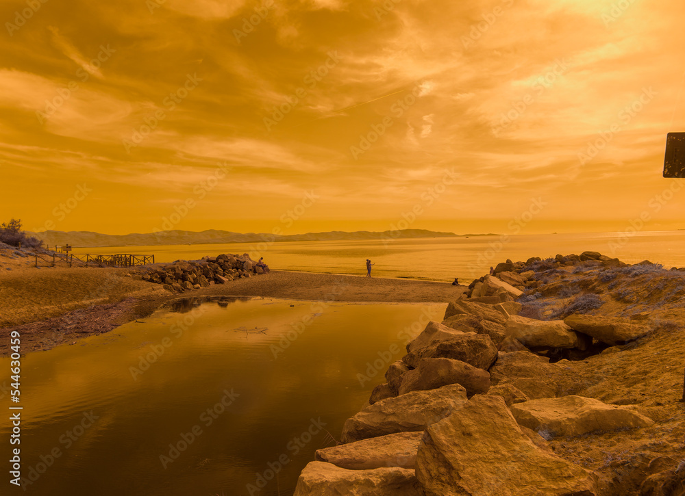 Obraz premium Infrared photography, view against the sun of Riotorto beach in the Gulf of Follonica, Tuscany Italy