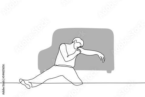 man sits on the floor leaning on a sofa - one line drawing vector. concept fatigue