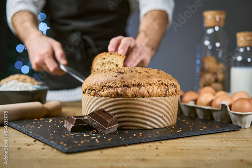 Panettone with cereals to celebrate Christmas and Holiday. Traditional Italian homemade Christmas panettone typical of Milan with flour, eggs, cereals, oats, spelled, barley and chocolate. 