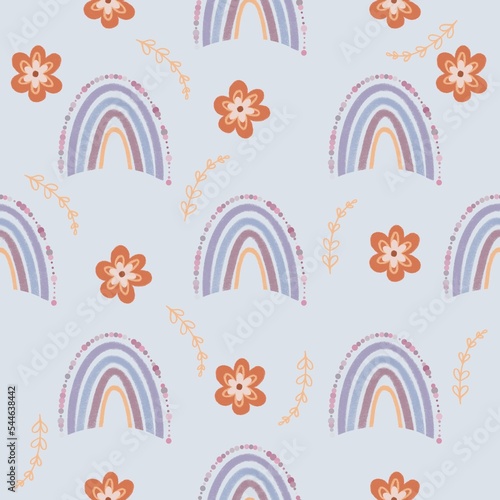 Boho rainbow seamless pattern. Boho rainbow with flower and leaf isolated on pastel blue background.