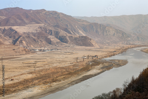 TUMEN, JILIN PROVINCE, CHINA: elevated view of farming village, near Namyang, in North Korea, across the Tumen river, from the Chinese side, Yanbian Korean Autonomous Prefecture photo