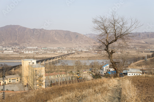 TUMEN, JILIN PROVINCE, CHINA - April 2008: railway bridge crossing the border, over the Tumen river, to Namyang (North Korea), Yanbian Korean Autonomous Prefecture photo