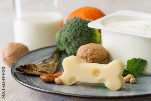 Bone shaped cheese and bone strengthening foods products, concept osteoporosis and prevention photo