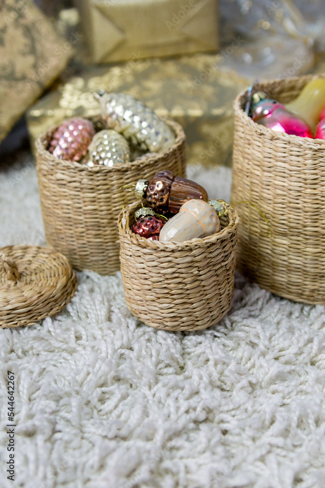 Vintage Christmas glass decorations in round baskets.
