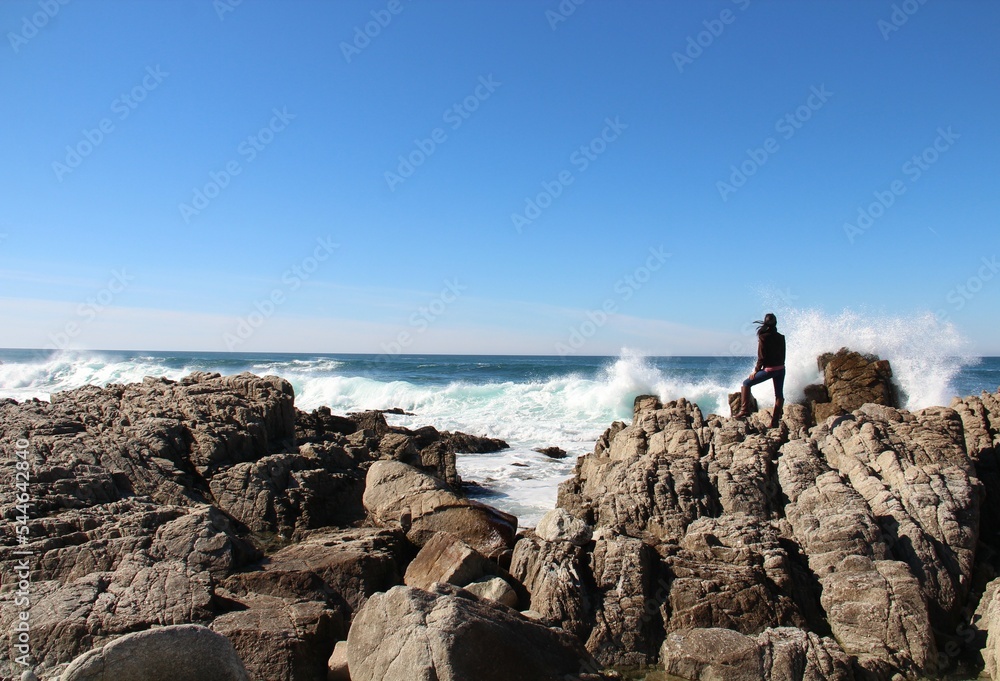 woman on top of lava rocks, 17 Mile Drive, Monterey County, California