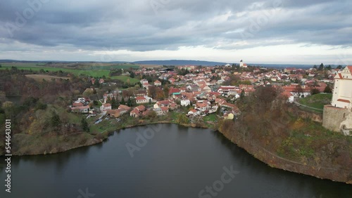 Aerial view of picturesque Czech town Plumlov with castle, Olomouc Region,reflected on the surface of Plumlov Lake, designed by Charles Eusebius of Liechtenstein. Tourist spot, Czech republic,panorama photo