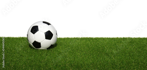 Soccer ball on green sports floor isolated on white © Alekss