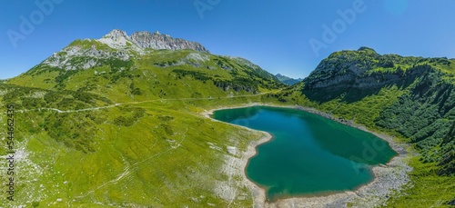 Hochgebirgslandschaft am Formarinsee, im Hintergrund die Rote Wand, höchster Gipfel der Region photo