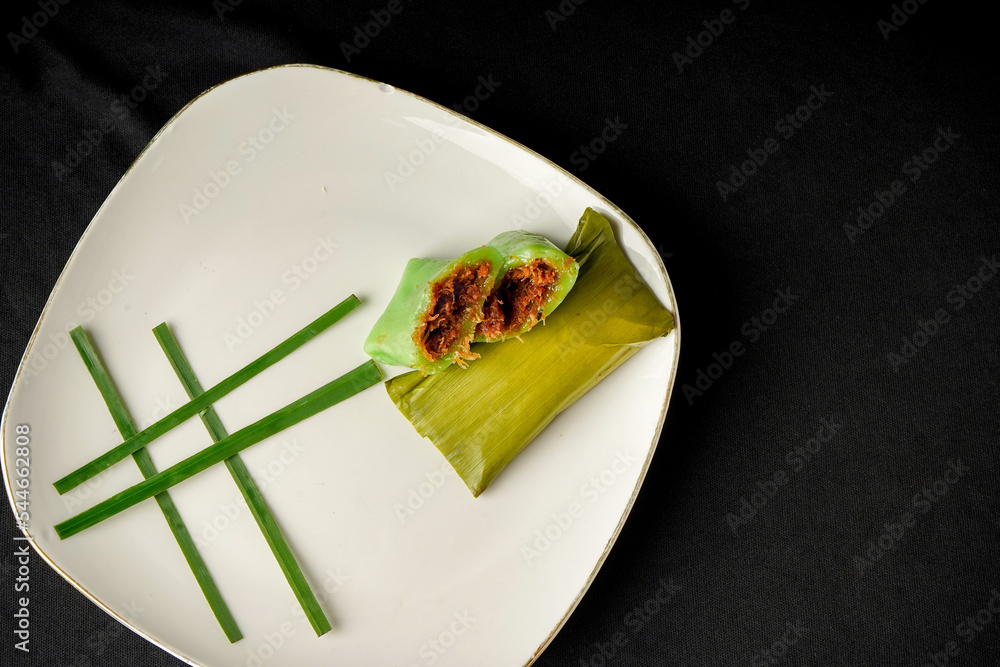 Doko Doko Cangkuli Cake is a typical snack from South Sulawesi, Indonesia. Traditional cake wrapped in banana leaves. Doko Doko Cangkuli Cake is a typical snack from South Sulawesi, Indonesia. Traditional cake wrapped in banana leaves.
