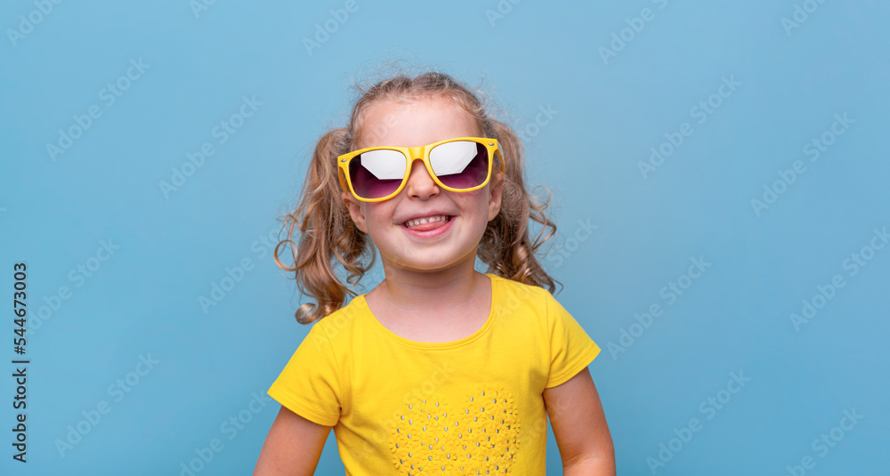 Little girl in yellow sunglasses.