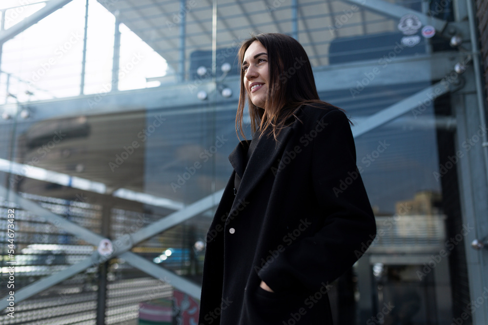 Fototapeta premium stylish woman anti-crisis manager on the background of a modern office building, organization activity analysis concept