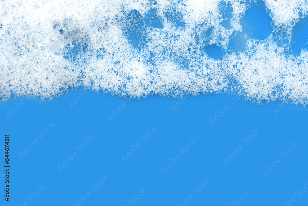 Soap foam. Background of dusty foam with bubbles of blue color for an inscription. Soap sud with copy-space Soap foam. Background of dusty foam with bubbles of blue color for an inscription. Soap sud with copy-space