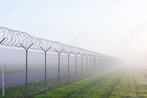 Obraz na plátne long fence border in mist