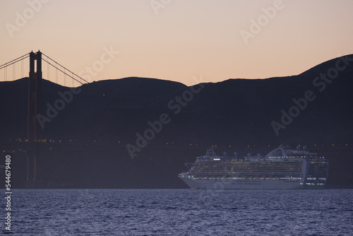 Princess cruiseship or cruise ship liner Ruby P in San Francisco port Bay terminal sail away cruising with Sausalito skyline twilight blue hour sunset sky Golden Gate sailing boats yachts sunset photo