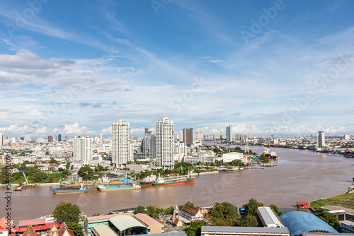 Photography Aerial view Chao Phraya of Bangkok skyline and skyscraper with light trails on Sathorn Road center of business in Bangkok downtown