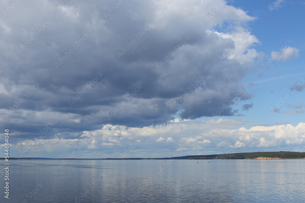 Clouds in the sky over the river