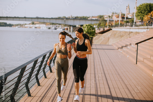 Young woman taking running ...