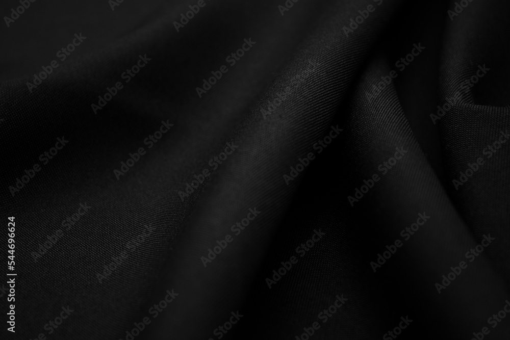Texture of dark black fabric closeup. Low key photo. Plexus threads. Clothing industry. Abstract background. Black textile waves. Black cloth background Texture of dark black fabric closeup. Low key photo. Plexus threads. Clothing industry. Abstract background. Black textile waves. Black cloth background