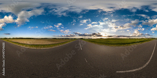 full seamless spherical hdri 360 panorama view on no traffic asphault road among fields with evening sky and clouds in equirectangular projection,can be used as replacement for sky in panoramas photo