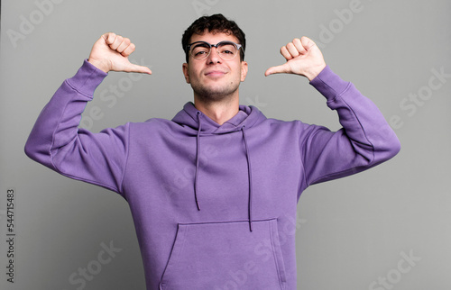 feeling proud, arrogant and confident, looking satisfied and successful, pointing to self