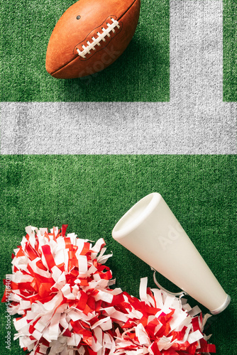 Sports: Cheer Poms And Megaphone On Field With Ball