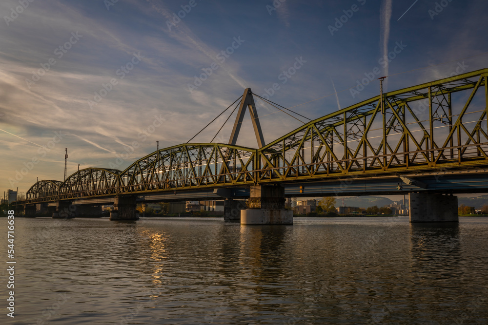Railway and road bridges in Linz town in Austria in autumn evening