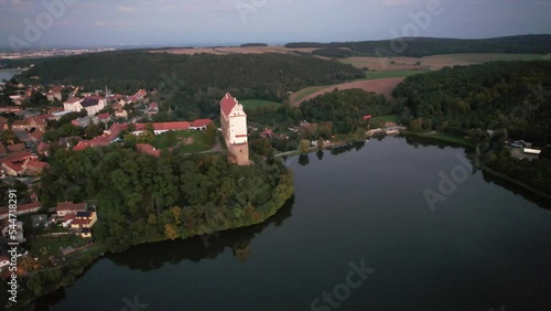 Aerial view of picturesque Czech town Plumlov with castle, Olomouc Region,reflected on the surface of Plumlov Lake, designed by Charles Eusebius of Liechtenstein. Tourist spot, Czech republic photo