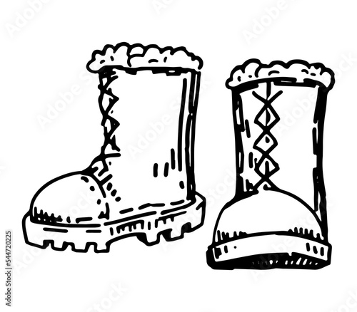 Doodle of warm boots. Outline drawing of winter footwear. Hand drawn vector illustration. Single clipart isolated on white background.