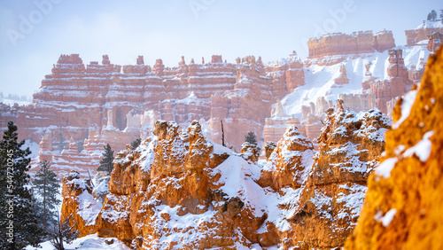 bryce canyon national park in winter, unique rock formations in utah covered in snow, orange rocks in snow, cold winter in the usa