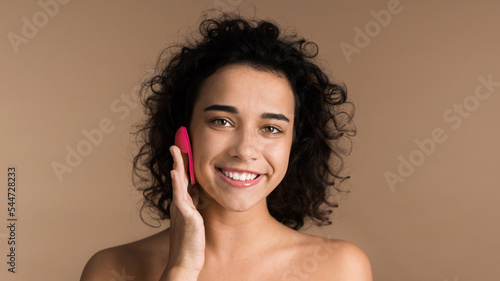 Young woman doing facial massage
