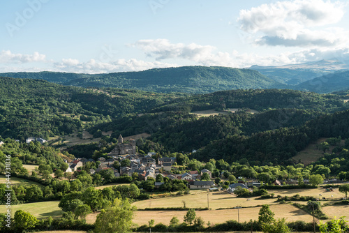 Saint-Nectaire village, view of the church and the valley, surrounded by the Monts Dore chain, part of the Auvergne Volcanoes Regional Nature Park