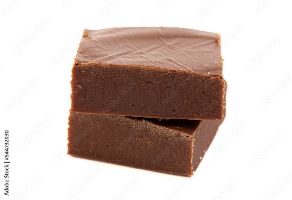 A Cube of Plain Chocolate Fudge Isolated on a White Background A Cube of Plain Chocolate Fudge Isolated on a White Background