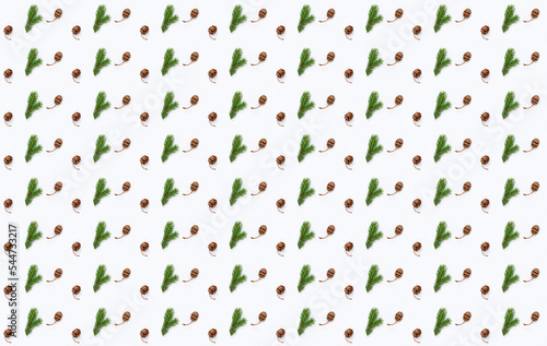 Christmas pattern of fir branches and cones on white background with snowflakes. Wonder of natural design.Gift wrapping paper design. Creative copy space