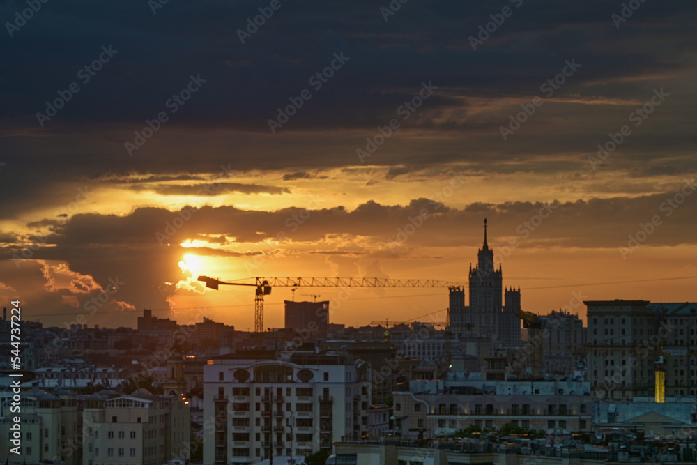 Naklejka premium July 10, 2021. Moscow Russia. Dawn over the Russian capital and a view of the Stalin high-rise on Kotelnicheskaya embankment in the early summer morning.