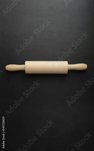 Empty baking background. For posting your products. Table with scattered flour and rolling pin. Top view. Flat lay.