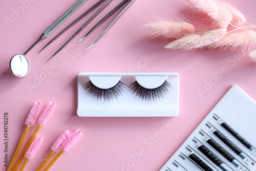 Картината върху платно Tools for eyelash extension on trendy pastel pink background