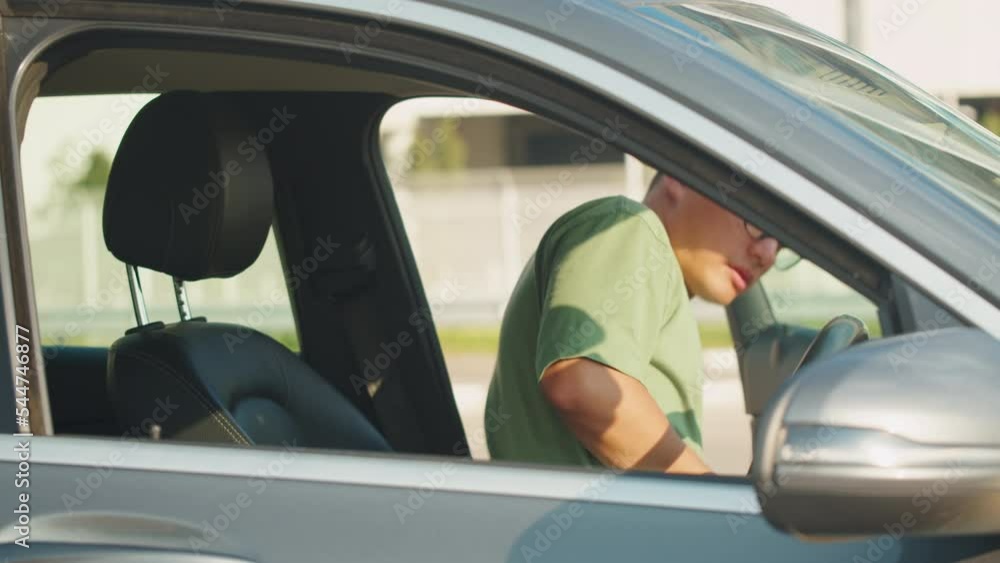 Young asian man driver in car, sharing concept, vehicle and premium transport. Korean happy guy driving, sitting in new luxury car and smiling. Traveling by automobile. Young asian man driver in car, sharing concept, vehicle and premium transport. Korean happy guy driving, sitting in new luxury car and smiling. Traveling by automobile.