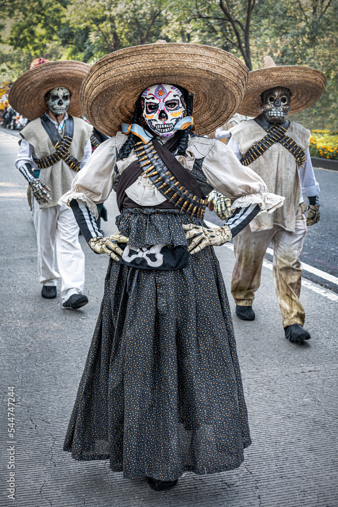 Mexican Catrina as they name an elegant deceased woman in the Day of the Dead festival.
Posing to represent and honor the death ones in the past Mexican revolution.
