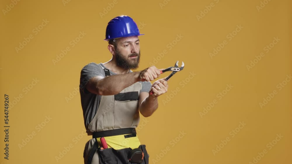Stockvideon Construction Craftsman Working With Steel Wrench On