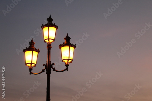 Beautiful vintage style street lamp at sunset © Berkay