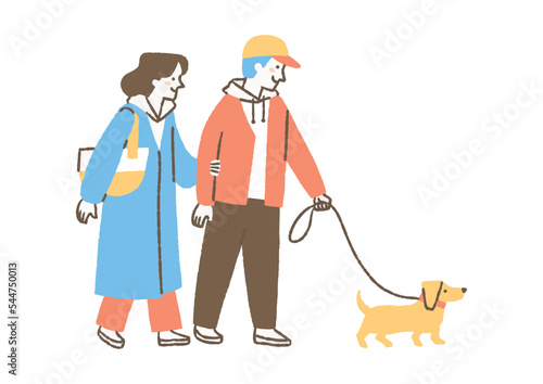 犬の散歩をする男女二人_色
