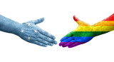 Handshake between Micronesia and LGBT flags painted on hands, isolated transparent image.