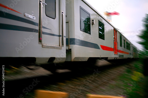 Motion blur of passanger train moving on railroad