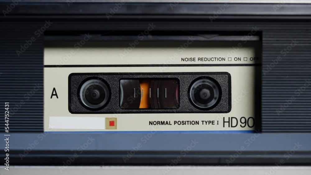 Retro radio tape recorder, audio cassette close-up. Listening to music, old radio boombox player, searching channel. Retro radio tape recorder, audio cassette close-up. Listening to music, old radio boombox player, searching channel.