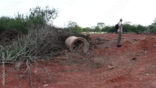 Wallpaper Mural Man from the environment inspecting land that is being cleared out for the construction of a new road in the Northwest section of Brasilia, Brazil, known as Noroeste  Torontodigital.ca