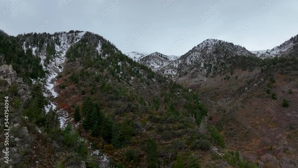 Aerial steep mountain forest early winter snow. Beautiful late autumn early winter Wasatch Mountains. Valley and alpine landscape. Mount Nebo Scenic Byway, Utah. Aspen, maple and oak trees colorful. Aerial steep mountain forest early winter snow. Beautiful late autumn early winter Wasatch Mountains. Valley and alpine landscape. Mount Nebo Scenic Byway, Utah. Aspen, maple and oak trees colorful.