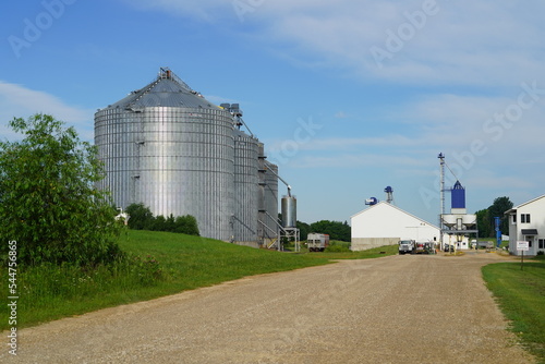 Grain elevator silos sit in the countryside.