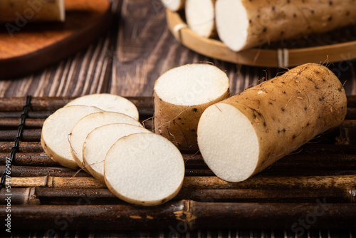 fresh Chinese yam on wooden table photo