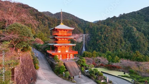 Japanese buddhist shrine in the mountains, Japanese culture and religion, asian tourist destination, Kumano Nachi Taisha temple and Nachi falls photo